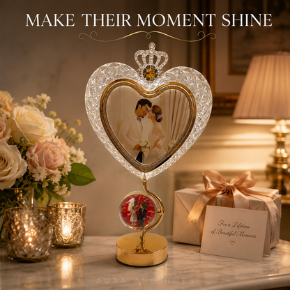 Royal detail of crystal heart photo frame with golden crown and amber gem