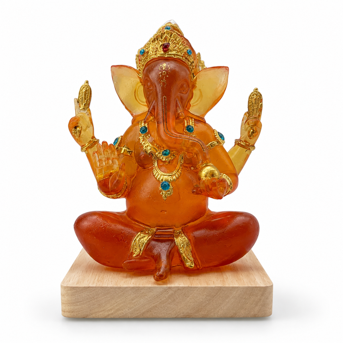 Ganesha LED idol close-up showing intricate gold accents and translucent resin