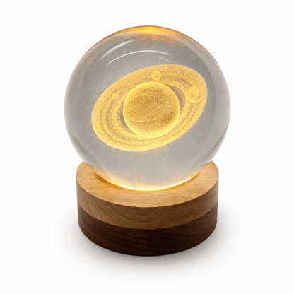 Saturn Crystal Globe on bedside table with gift box