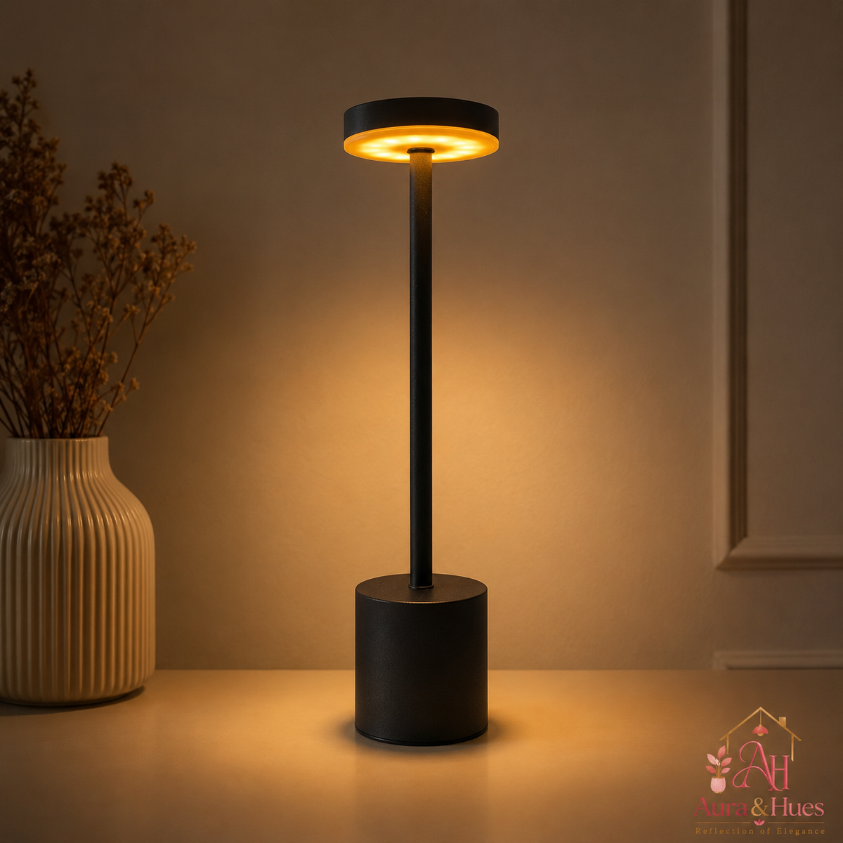 Aura & Hues Table Lamp glowing warm light on a shelf