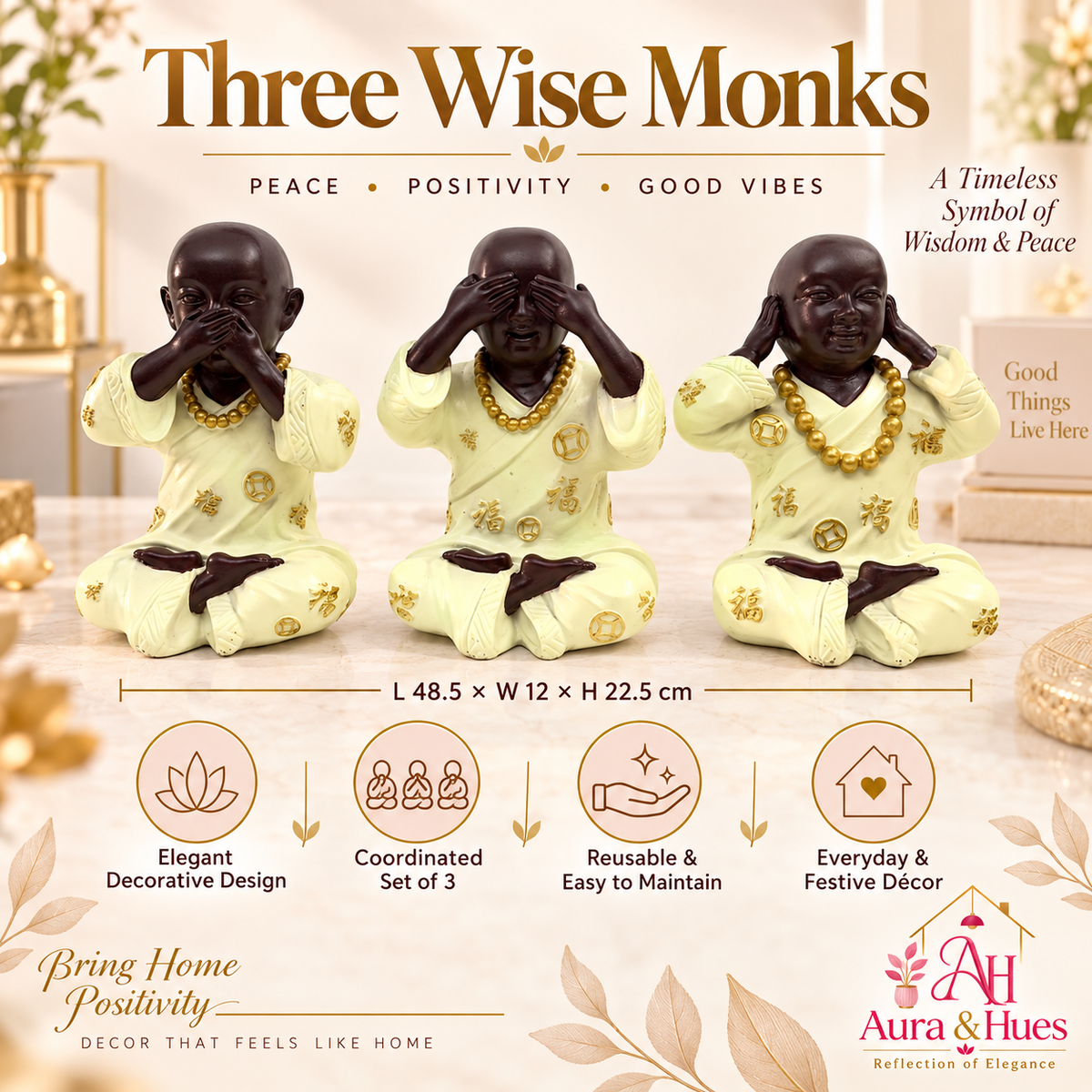 Three meditating monk figurines with cream robes and gold details